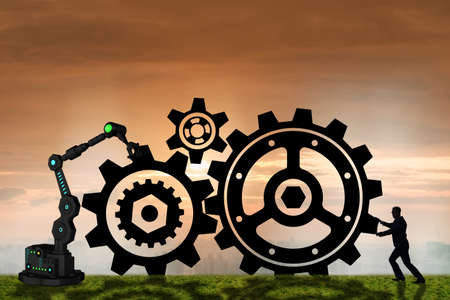 Teamwork concept with businessman and cogwheelsの写真素材