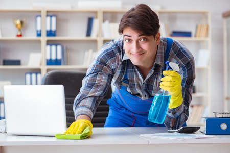 Cleaner man cleaning the officeの写真素材