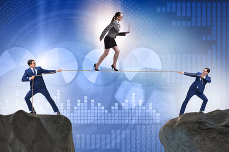 Business concept with tight rope walkerの写真素材