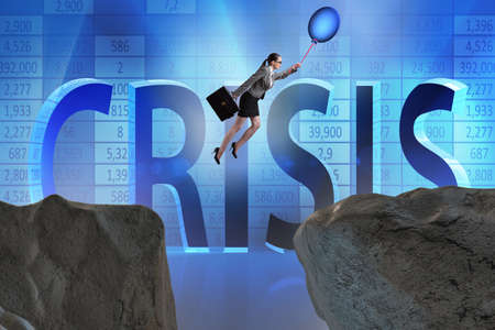 Businesswoman flying holding balloonの写真素材