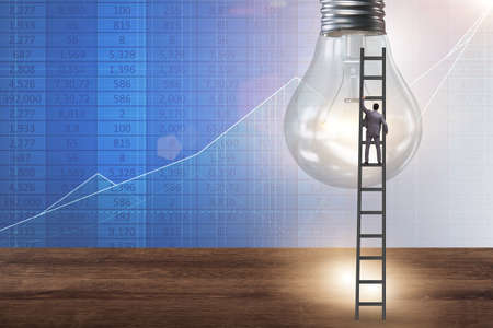 Businessman in new idea concept with light bulbの写真素材