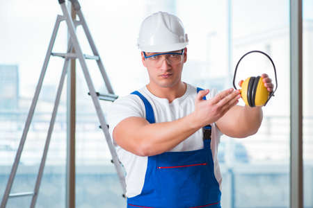 Young worker with noise cancelling headphones