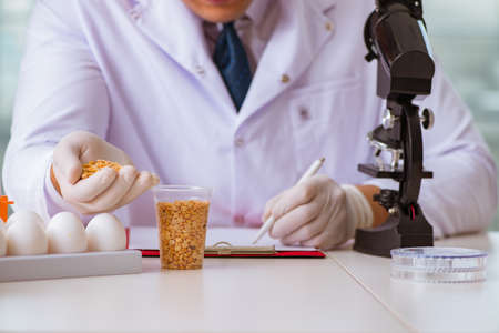 Nutrition expert testing food products in labの写真素材
