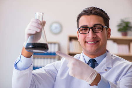 Young lab assistan working in the laboratoryの写真素材