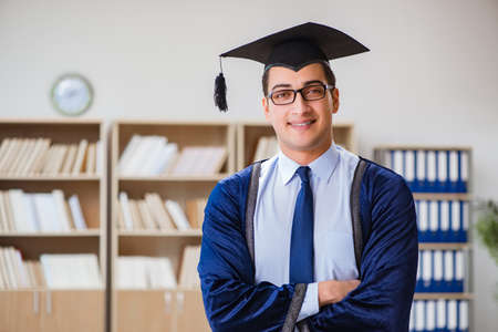 Young man graduating from universityの写真素材