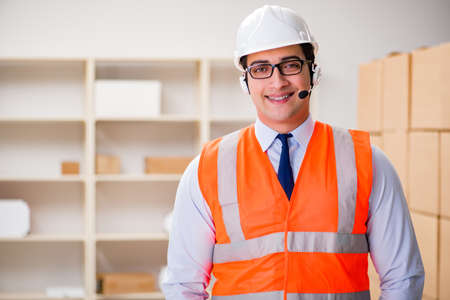 Man working in postal parcel delivery service office