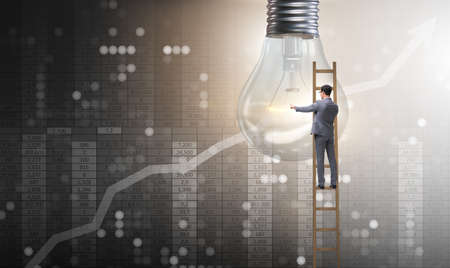 Businessman in new idea concept with light bulbの写真素材