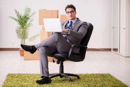 Businessman sitting on the chair in officeの写真素材