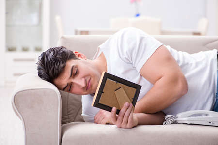 Young man in sad saint valentine conceptの写真素材