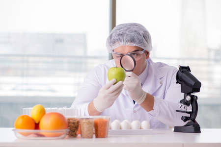 Nutrition expert testing food products in labの写真素材