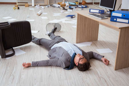 Businessman dead on the office floorの写真素材