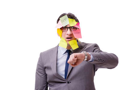 Businessman with many reminders isolated on whiteの写真素材