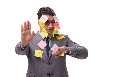 Businessman with many reminders isolated on whiteの写真素材