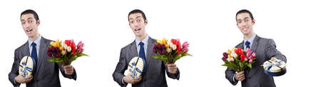 Businessman with giftbox and flowersの写真素材