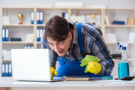 Hacker under cleaner cover stealing personal dataの写真素材
