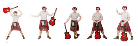 Scotsman playing guitar isolated on whiteの写真素材