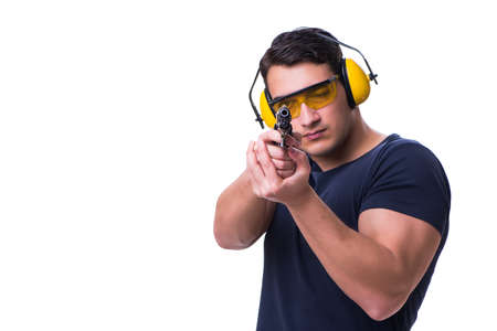 Man doing sport shooting from gun isolated on whiteの写真素材