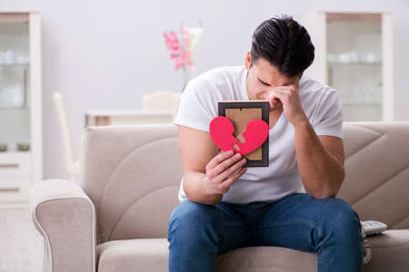 Young man in sad saint valentine conceptの写真素材