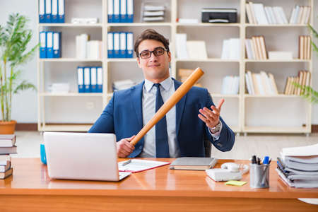 Angry aggressive businessman in the officeの写真素材