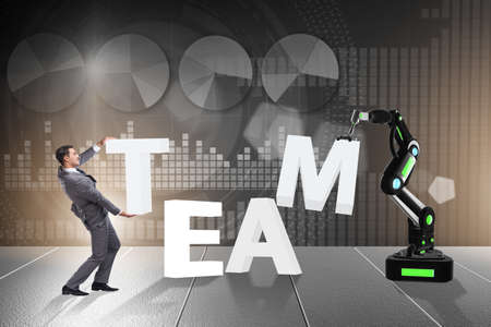 Man and robotic arm in teamwork concept