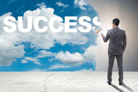 Businessman painting in business conceptの写真素材