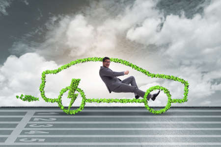 Electric car concept in green environment conceptの写真素材