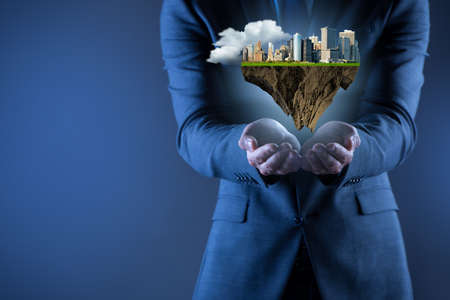 Architect holding plan of futuristic cityの写真素材