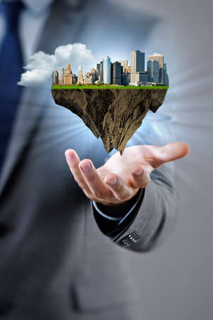 Architect holding plan of futuristic cityの写真素材