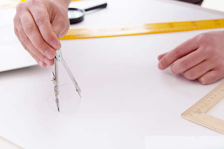 Male engineer working on drawings and blueprints