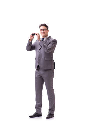 Young man with binoculars isolated on whiteの写真素材