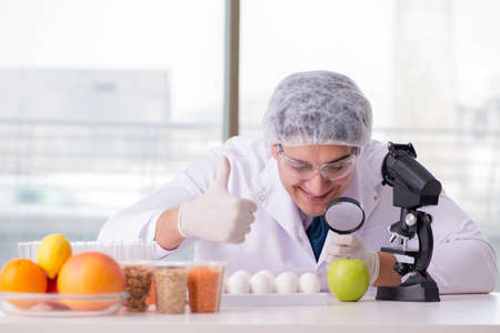 Nutrition expert testing food products in labの写真素材