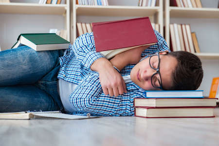 Young student studying with books