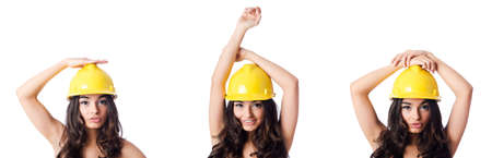 Young woman with yellow hard hat on whiteの写真素材