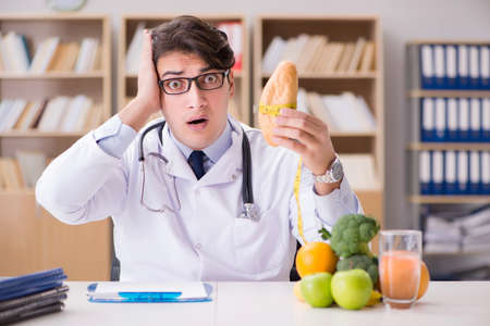 Scientist studying nutrition in various foodの写真素材