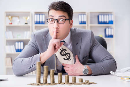 Businessman with golden coins in business growth conceptの写真素材