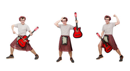 Scotsman playing guitar isolated on whiteの写真素材