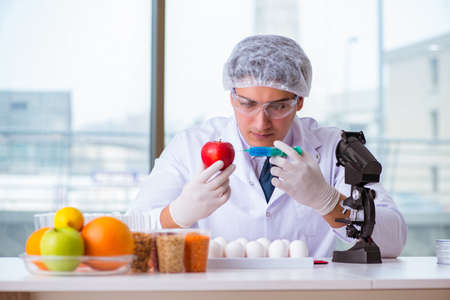 Nutrition expert testing food products in labの写真素材