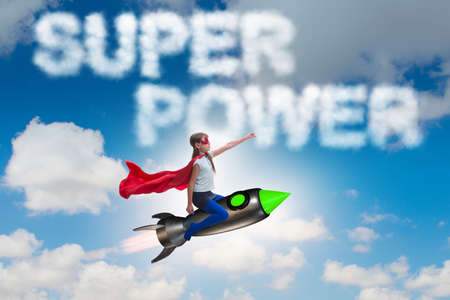 Little girl flying rocket in superhero concept