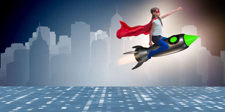Little girl flying rocket in superhero conceptの写真素材