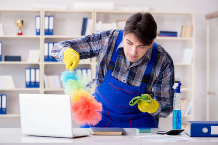 Male cleaner working in the office