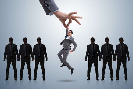 Recruitment concept with hand picking employeeの写真素材
