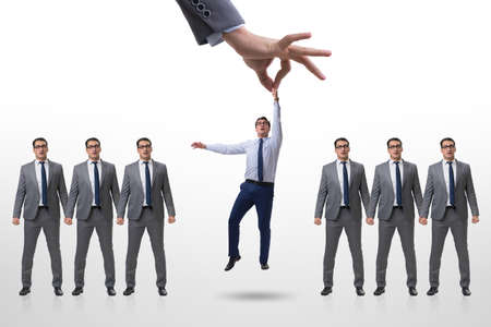 Recruitment concept with hand picking employeeの写真素材