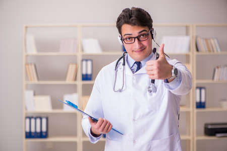 Young man doctor in medical conceptの写真素材