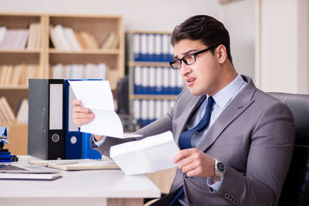 Businessman receiving letter in the officeの写真素材