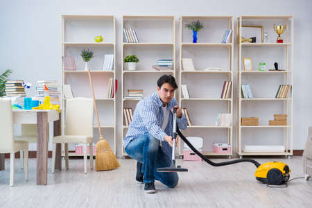 Man doing cleaning at homeの写真素材