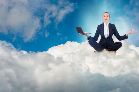 Businesswoman working in the sky and meditatingの写真素材