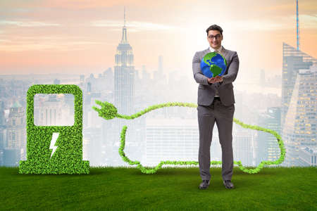 Electric car concept in green environment conceptの写真素材