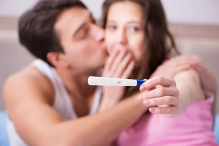 Young family with pregnancy test resultsの写真素材