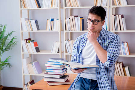 Young student with books preparing for examsの写真素材
