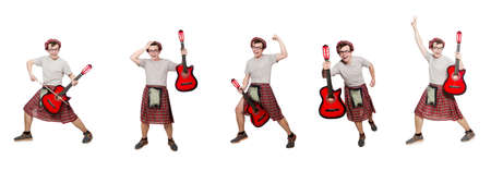 Scotsman playing guitar isolated on whiteの写真素材